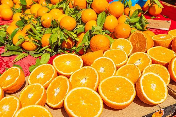 Italy-Apulia-Metropolitan City of Bari-Locorotondo Oranges for sale in an outdoor market